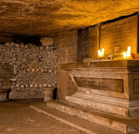 Altar with candles on one side filled with human bones